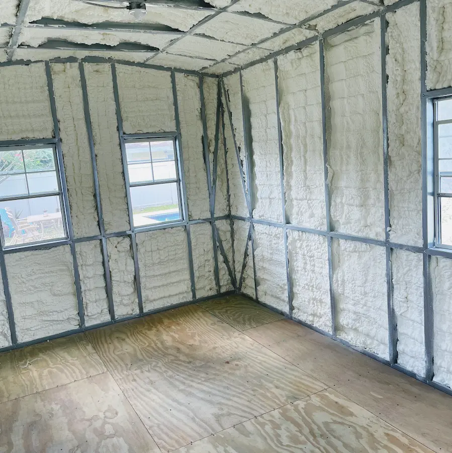 Closed-cell spray foam insulation applied to wall cavities in a residential project in Plant City